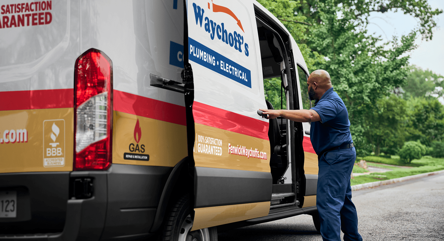 A professional Fenwick Waychoff's technician opening a service van on a residential street, ready to provide home HVAC, plumbing, and electrical services.