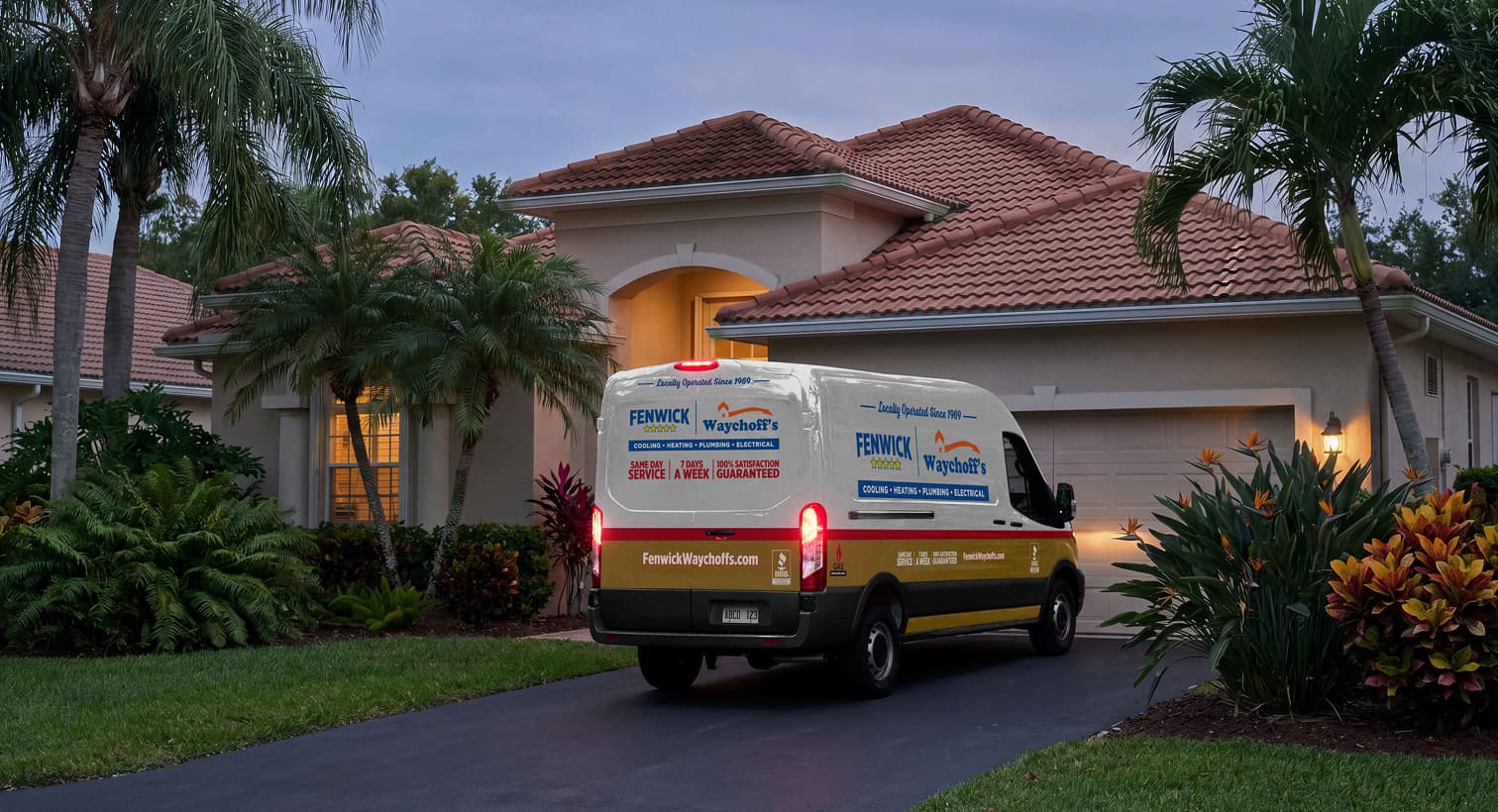A Fenwick Waychoff's service van parked in a residential driveway at night, arriving to provide 24/7 emergency heating repair services.