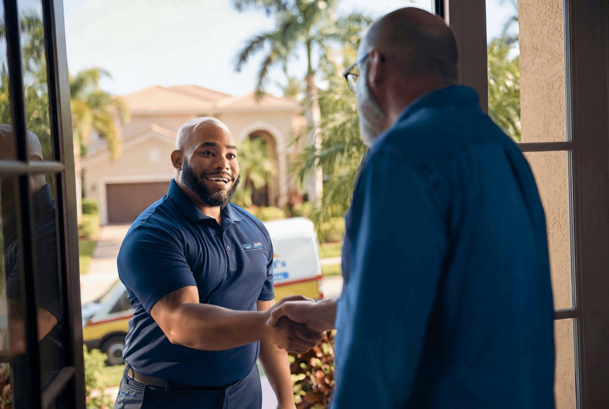 Technician shaking customers hand